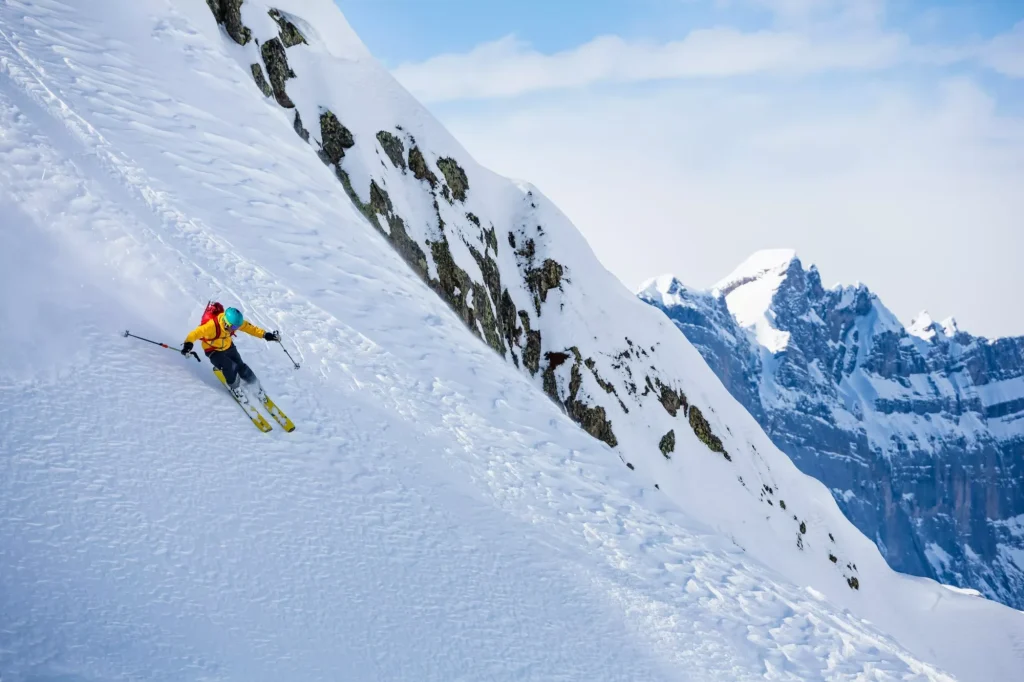 Skiing in the snowy mountains, good winter day.
